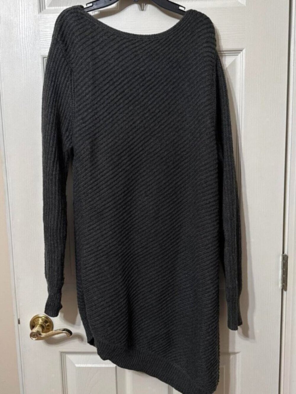 Mossimo black long sleeve sweater dress with an asymmetrical fit